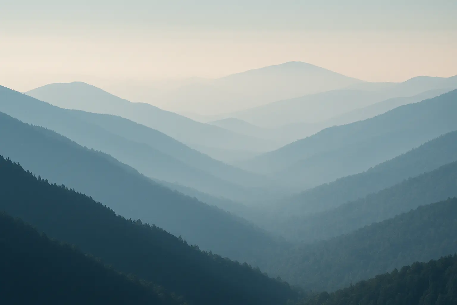 Dramatic alpine mountain peaks with atmospheric lighting and layered ridges