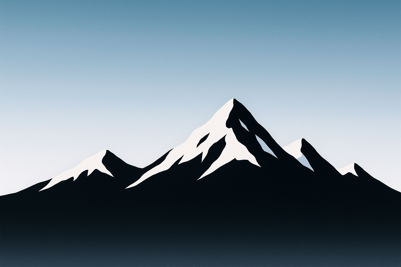 Snow-covered mountain silhouettes against winter sky